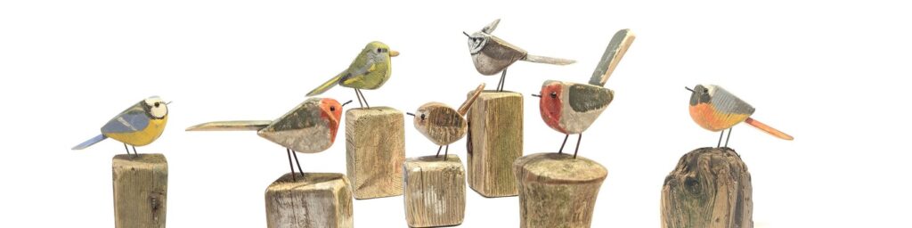 wood carved birds made from reclaimed materials and driftwood
